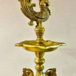 Ornate brass hookah with a peacock finial and decorative curved branches on a tray base  thebrasshandicrafts.com