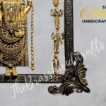 Close-up of an ornate brass statue with multiple tiny figures on a decorative frame.  thebrasshandicrafts.com