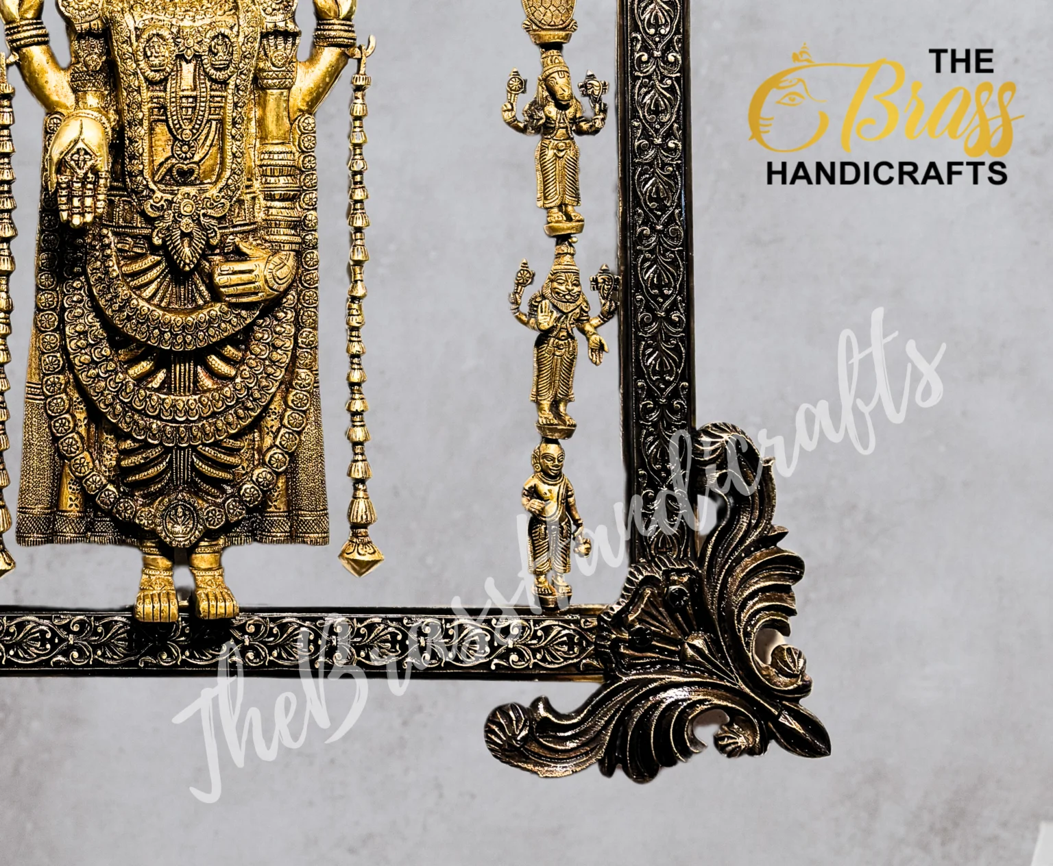 Close-up of an ornate brass statue with multiple tiny figures on a decorative frame.  thebrasshandicrafts.com