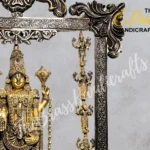 Brass Hindu deity statue with multiple arms, adorned with jewelry, inside an ornate metal frame.  thebrasshandicrafts.com