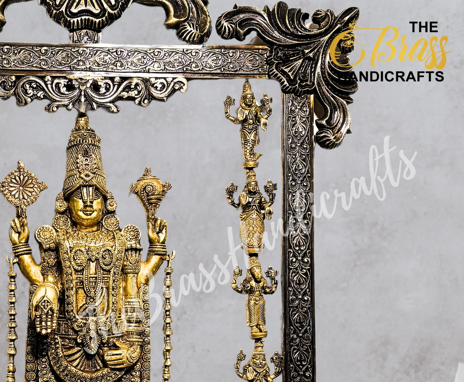 Brass Hindu deity statue with multiple arms, adorned with jewelry, inside an ornate metal frame.  thebrasshandicrafts.com