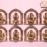 Row of gold brass Hindu deities in decorative arches against a pink background, with a 'The Brass Handicrafts' logo in the corner.  thebrasshandicrafts.com