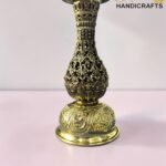 Ornate gold-hookah base with intricate filigree on a pink surface, logo 'The Brass Handicrafts' in the lower right corner.  thebrasshandicrafts.com