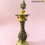 Ornate brass hookah with intricate engravings against a pink background; The Brass Handicrafts logo visible in the corner.  thebrasshandicrafts.com