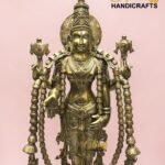 Golden multi-armed deity statue with ornate jewelry on a pink background; The Brass Handicrafts branding is visible.  thebrasshandicrafts.com