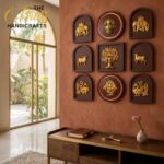 Left side shows 'The Boss Handicrafts' sign by a window; gold wall plaques of elephant and tree on brown panels.  thebrasshandicrafts.com