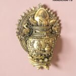 IMG_6161 - thebrasshandicrafts.com Ornate gold brass decorative piece against a pink background with lotus motifs and intricate patterns. thebrasshandicrafts.com
