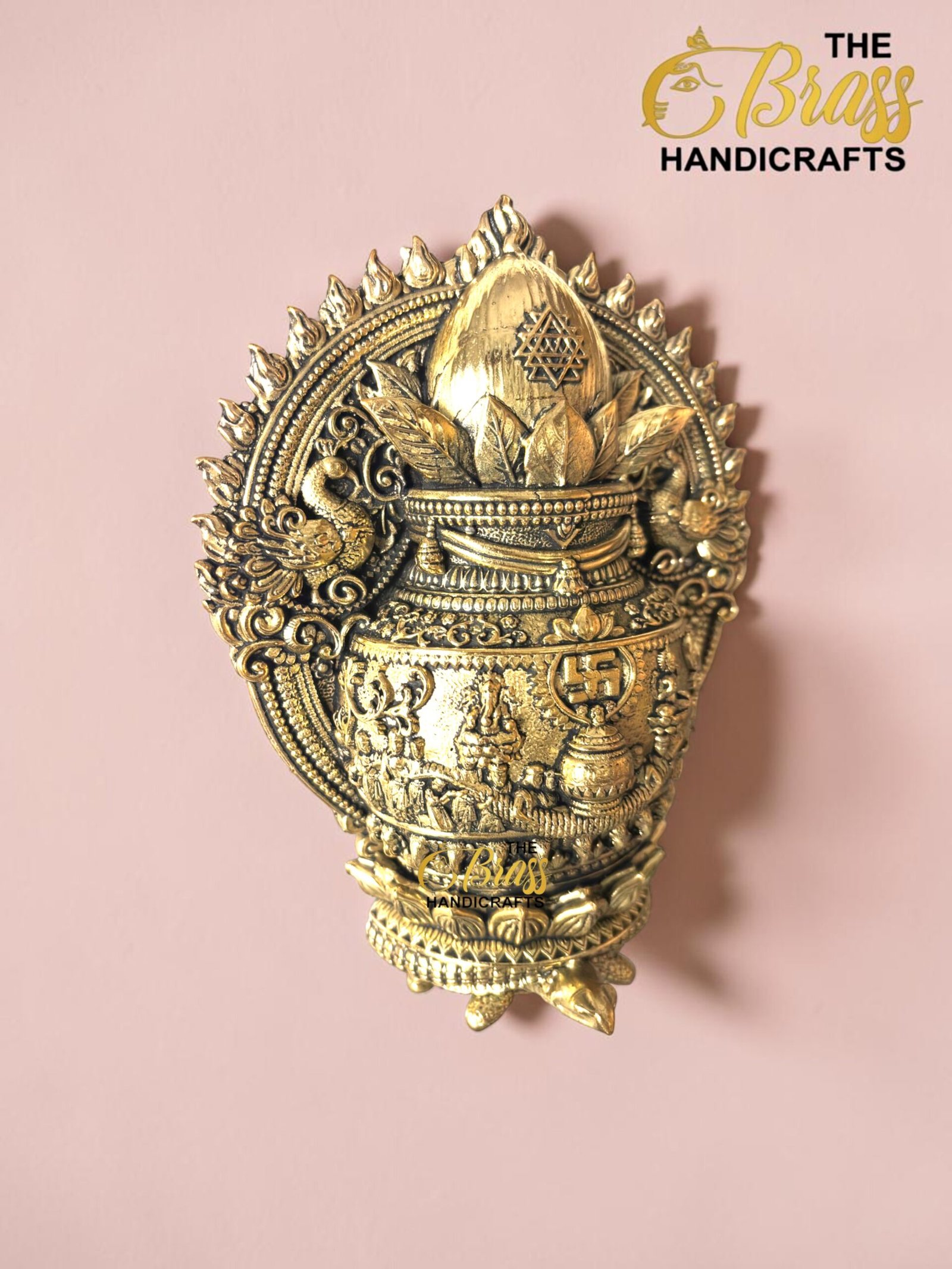 IMG_6161 - thebrasshandicrafts.com Ornate gold brass decorative piece against a pink background with lotus motifs and intricate patterns. thebrasshandicrafts.com