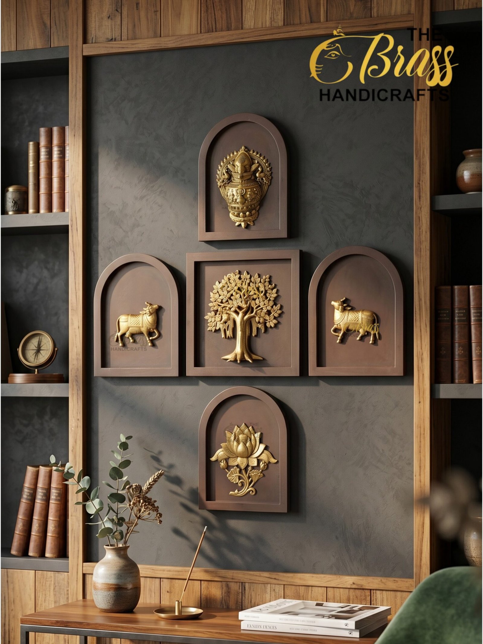 panch tatva 1 - thebrasshandicrafts.com Decorative wall display of gold bas-relief panels in brown frames on a gray wall, flanked by wooden shelves with books and pottery. thebrasshandicrafts.com
