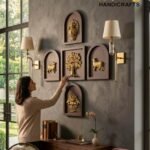 panch tatva - thebrasshandicrafts.com Woman in beige sweater reaches toward a wall with gold relief panels arranged in frames, in a study with a wooden desk and globe nearby. thebrasshandicrafts.com