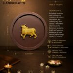 Samudra Manthan 3 - thebrasshandicrafts.com Gold cow figurine mounted in a circular display against a brown background; part of a Kamdhenu wall frame advertisement emphasizing abundance and prosperity. thebrasshandicrafts.com