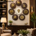 Living room display with nine circular brass plaques featuring gold animal designs arranged on a beige wall, with warm lighting and decorative objects around it.  thebrasshandicrafts.com