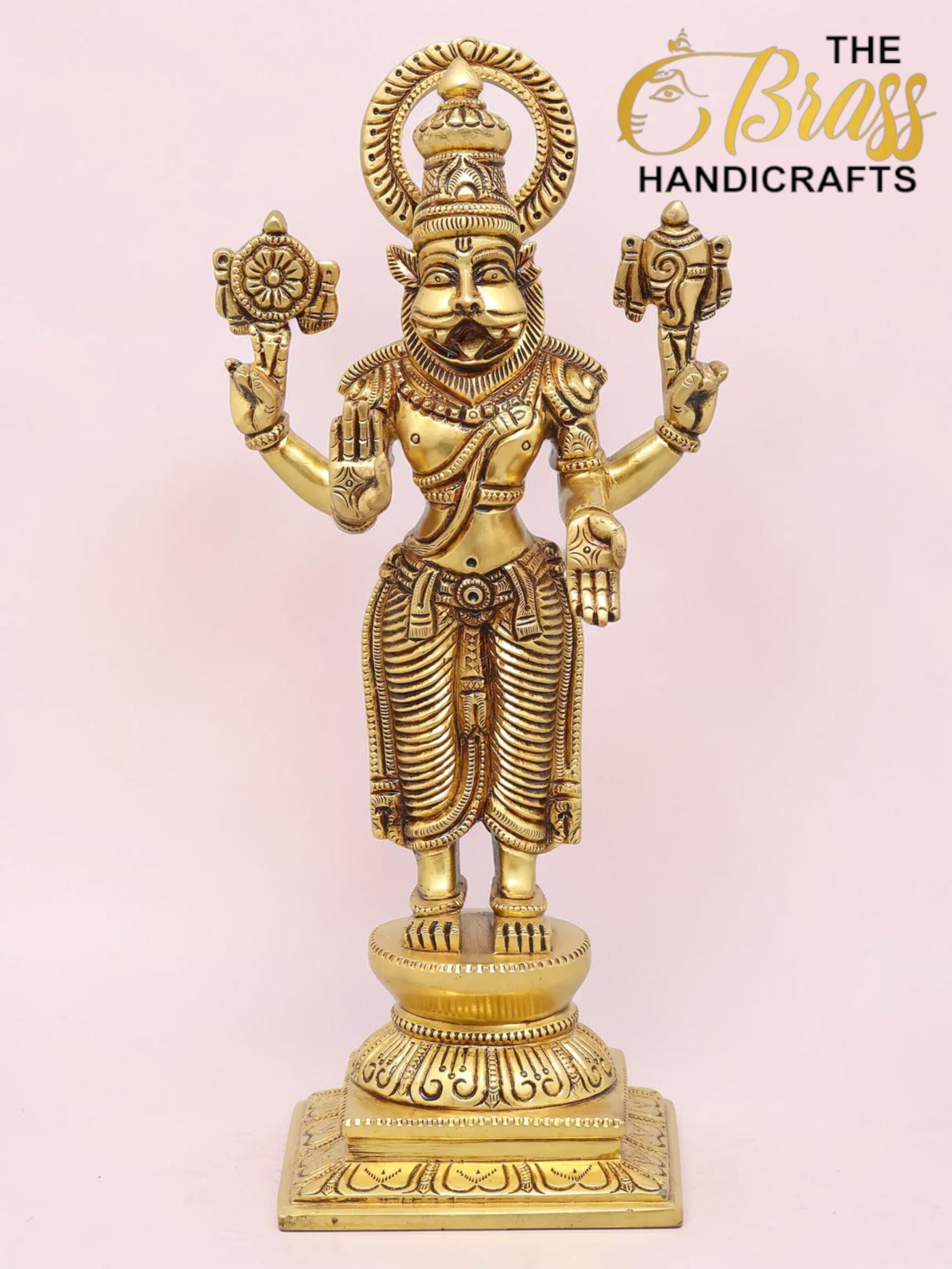 Gold brass statue of a Hindu deity with multiple arms and an ornate headdress, standing on a carved pedestal.  thebrasshandicrafts.com