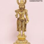 Gold-toned brass statue of a Hindu sage with a tall headdress and halo, standing on an ornate pedestal.  thebrasshandicrafts.com