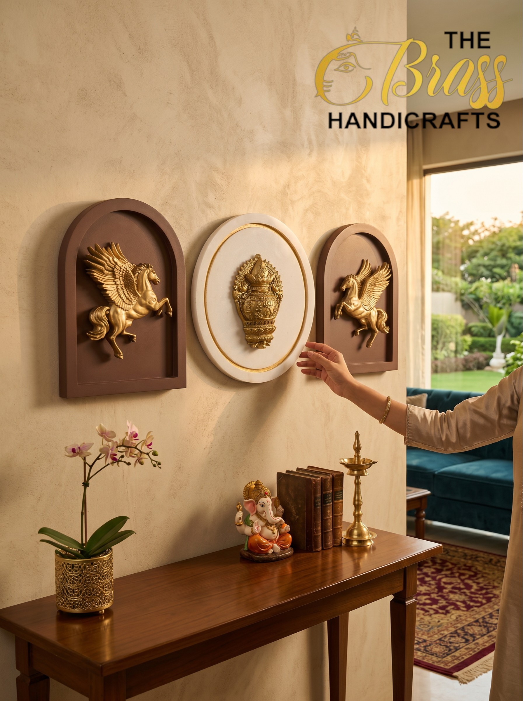 Wall display of three decorative plaques (center round emblem) with a hand reaching toward them; showroom setting.  thebrasshandicrafts.com
