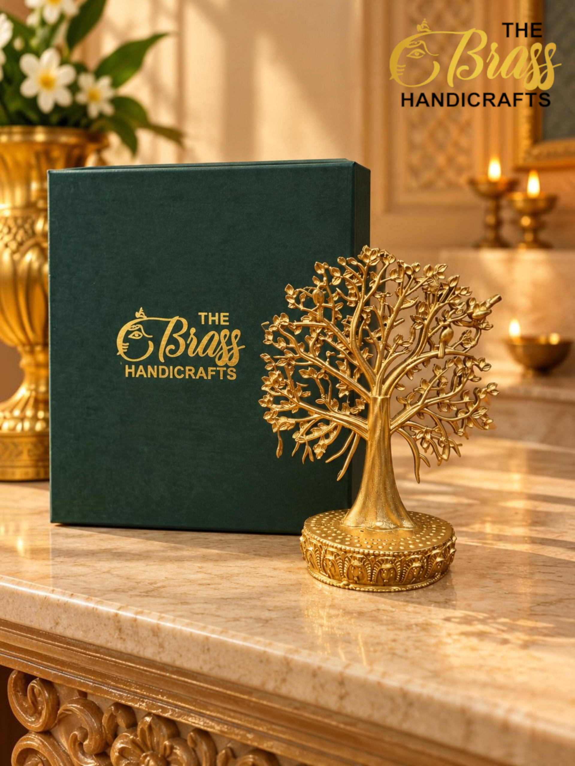 Green display box with gold logo reading The Brass Handicrafts, a gold decorative tree sculpture in front, on a marble counter with warm candles in the background.  thebrasshandicrafts.com