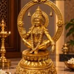 Golden Deity in a Temple Setting - thebrasshandicrafts.com Gold filigree statue of a Hindu deity inside a circular ornate frame, branded 'The Brass Handicrafts' in the corner thebrasshandicrafts.com