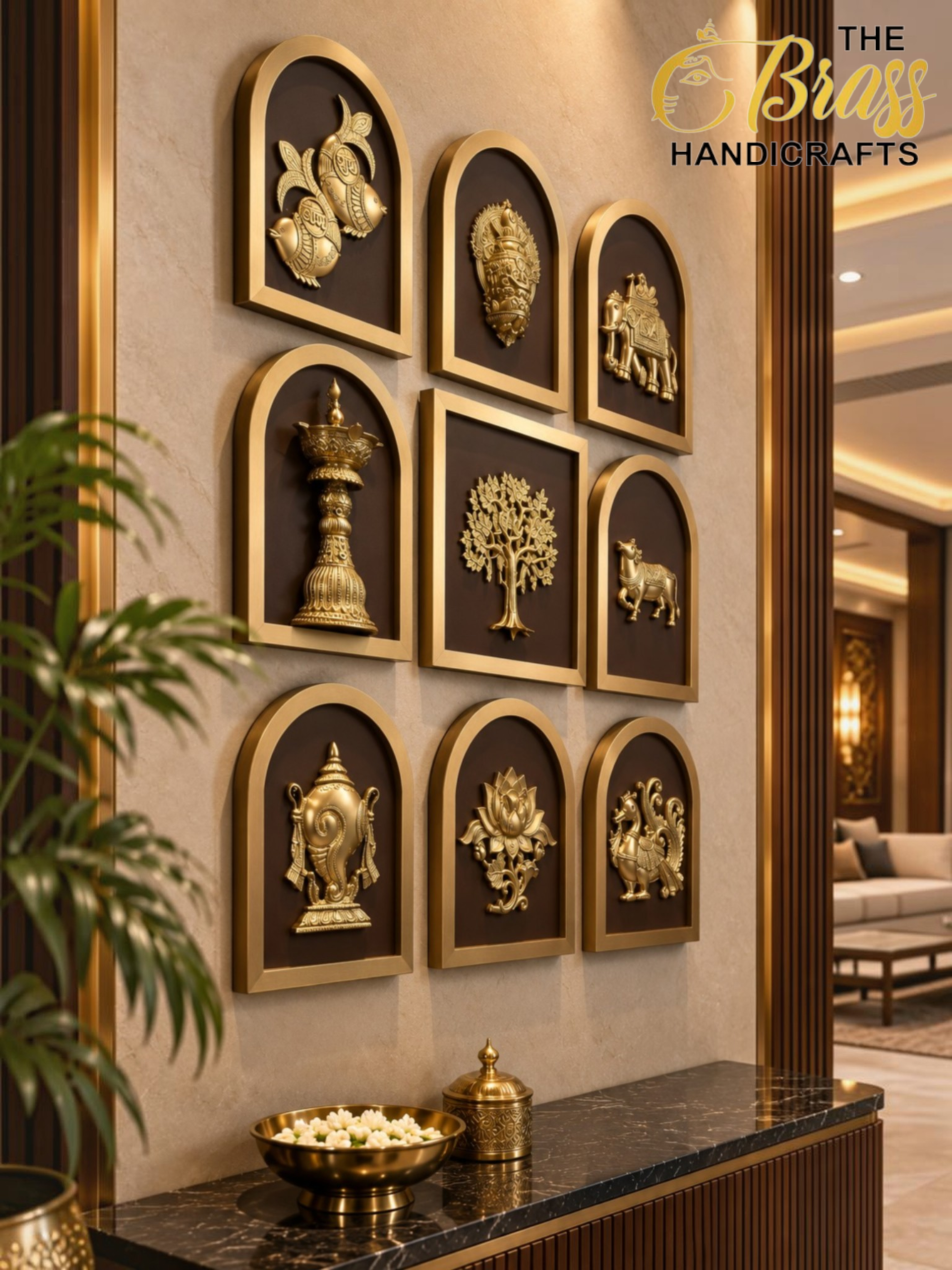 Nav Sampada 4 - thebrasshandicrafts.com Wall displaying gold brass reliefs in arched frames arranged in a grid, with a marble counter below and 'The Brass Handicrafts' logo in the top right. thebrasshandicrafts.com