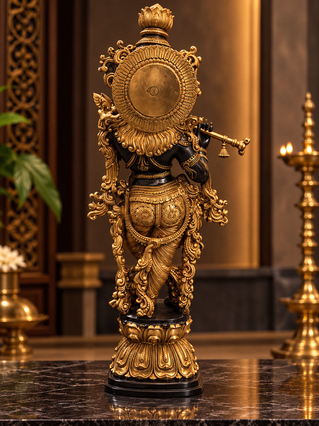 Ornate Bronze Deity with Radiant Halo - thebrasshandicrafts.com Back view of an ornate gold statue of a Hindu deity, standing on a decorative pedestal in a ceremonial room. thebrasshandicrafts.com