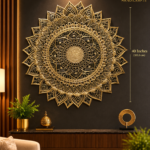 a640f0bd-ce58-48d2-80c6-749231ab0b16 - thebrasshandicrafts.com Large ornate gold mandala wall art (40 inches/101.6 cm diameter) mounted on a dark wall, with The Brass Handicrafts logo nearby. thebrasshandicrafts.com