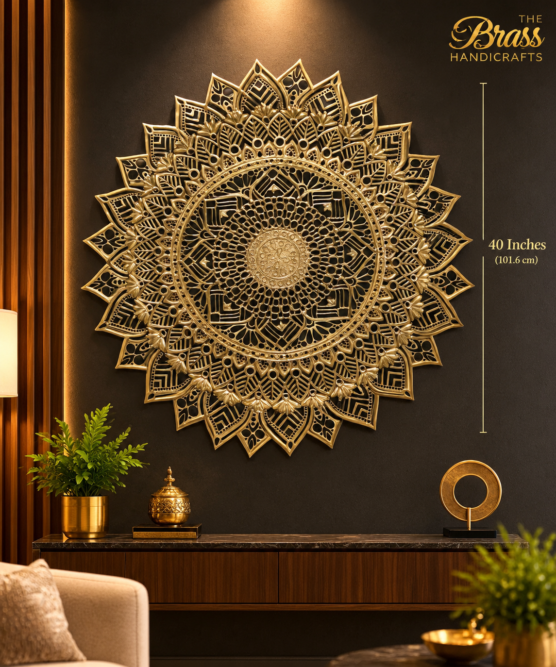a640f0bd-ce58-48d2-80c6-749231ab0b16 - thebrasshandicrafts.com Large ornate gold mandala wall art (40 inches/101.6 cm diameter) mounted on a dark wall, with The Brass Handicrafts logo nearby. thebrasshandicrafts.com