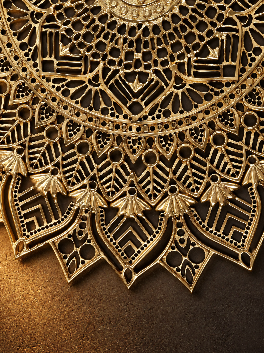 e872916b-74a8-459b-8c77-acf2adf852e0 - thebrasshandicrafts.com Close-up of an intricate gold mandala with detailed cutouts against a dark background (decorative ornament). thebrasshandicrafts.com
