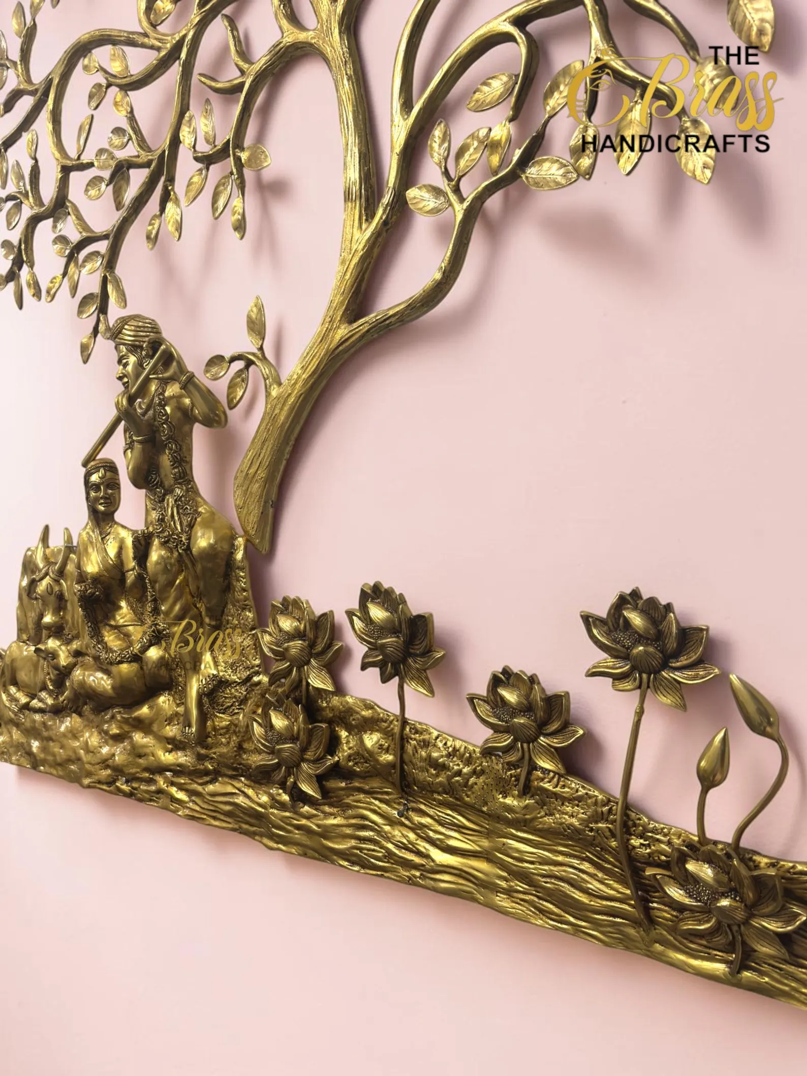 il_1588xN8398831906_l3cl - thebrasshandicrafts.com Gold brass wall sculpture of a tree with figures and flowers against a pink background. thebrasshandicrafts.com