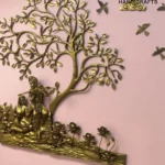 il_1588xN8398831974_m7h7 - thebrasshandicrafts.com Golden, intricately carved tree wall sculpture with human figures at its base against a pink background. thebrasshandicrafts.com