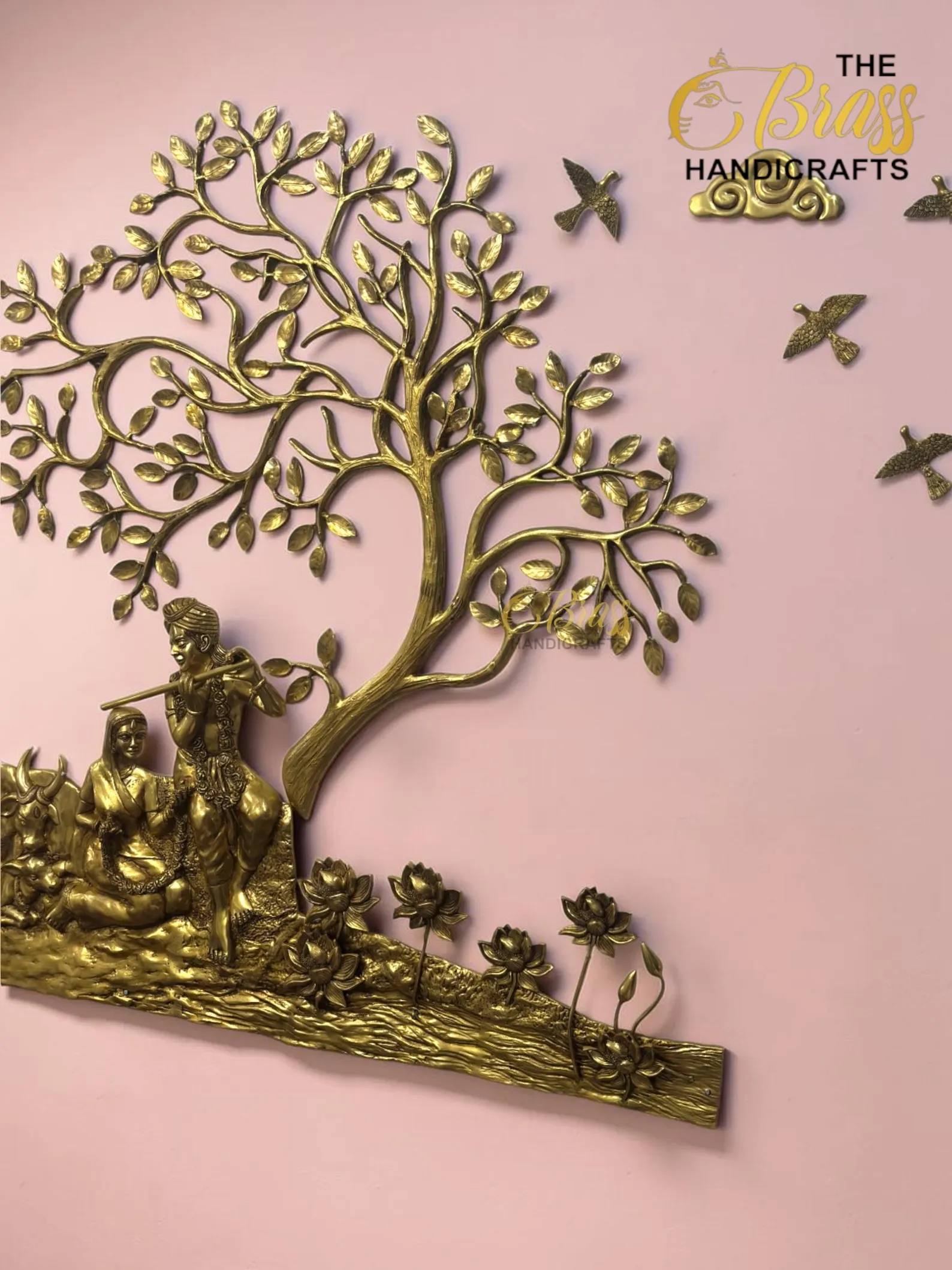 il_1588xN8398831974_m7h7 - thebrasshandicrafts.com Golden, intricately carved tree wall sculpture with human figures at its base against a pink background. thebrasshandicrafts.com