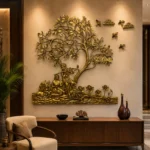 il_1588xN8446712353_assk - thebrasshandicrafts.com Gold wall sculpture of a tree with figures beneath and birds, mounted above a wooden console in a luxe interior (branding for The Brass Handicrafts). thebrasshandicrafts.com