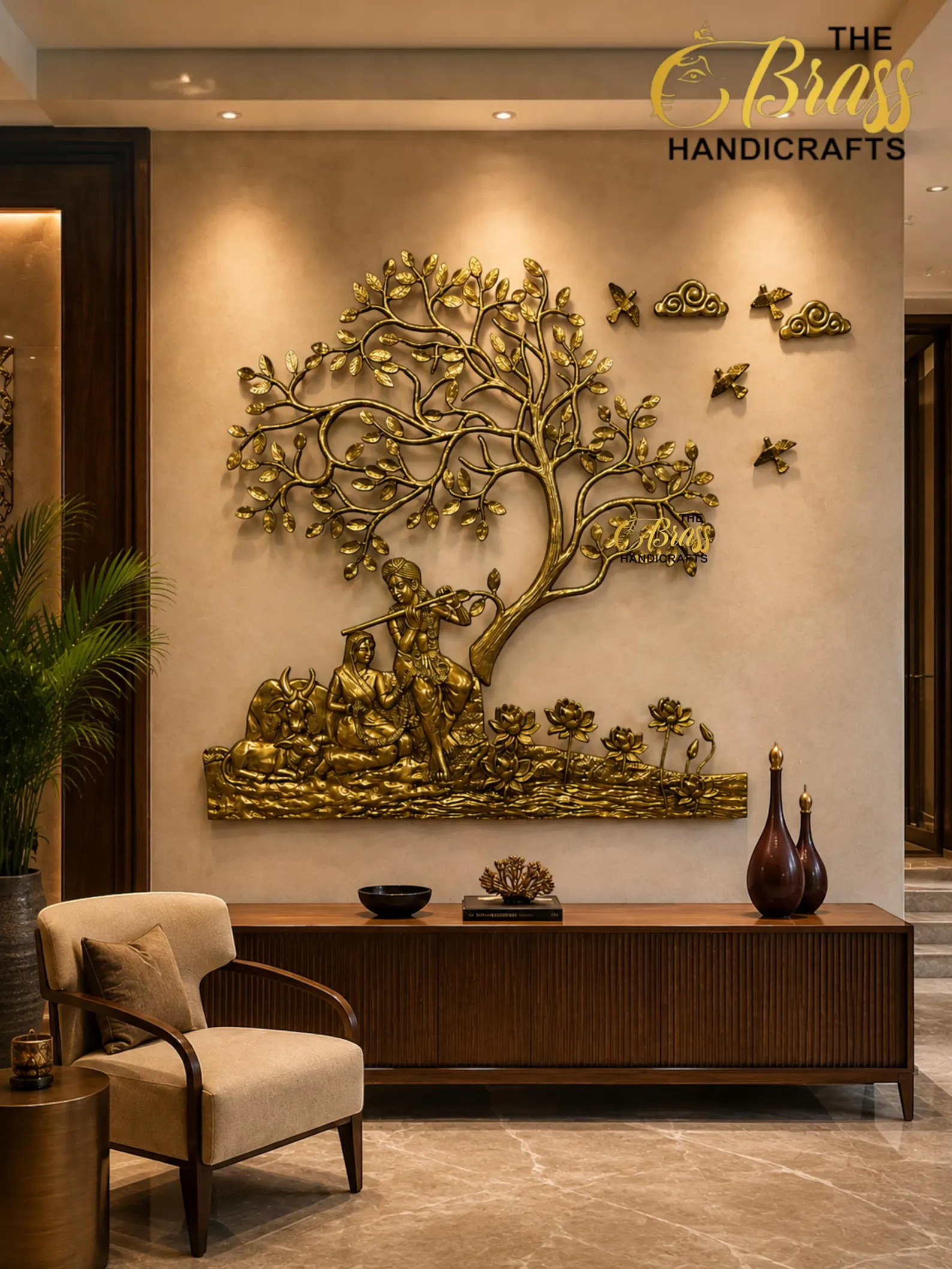 il_1588xN8446712353_assk - thebrasshandicrafts.com Gold wall sculpture of a tree with figures beneath and birds, mounted above a wooden console in a luxe interior (branding for The Brass Handicrafts). thebrasshandicrafts.com