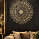 Intricately carved gold mandala wall art on a dark paneled wall above a beige sofa with gold-toned accents and cushions.  thebrasshandicrafts.com